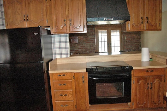 kitchen with decorative backsplash, french doors, extractor fan, and black appliances