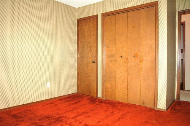 unfurnished bedroom with carpet flooring