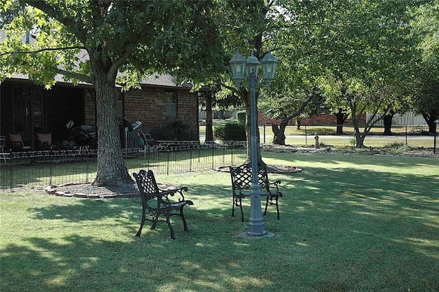 view of community featuring a yard