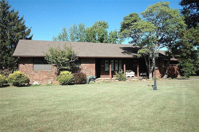 ranch-style home with a front yard