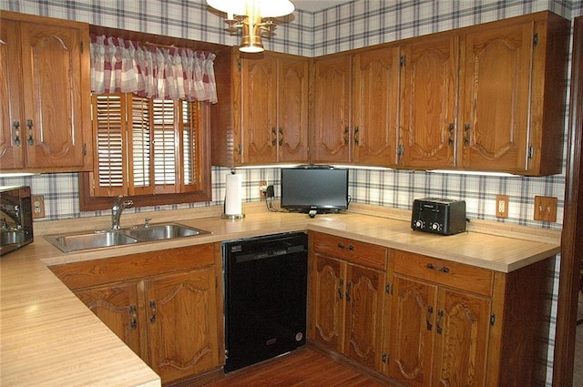 kitchen featuring sink, tasteful backsplash, dark wood-type flooring, and black appliances