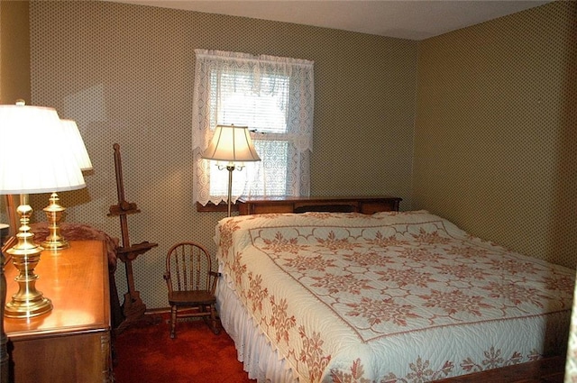 bedroom featuring dark colored carpet