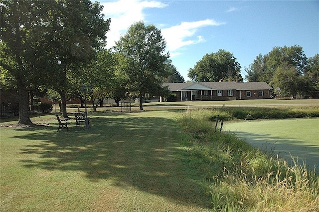 view of property's community with a lawn