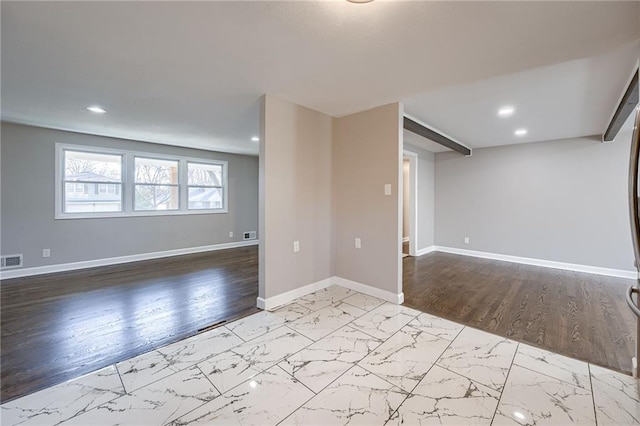 spare room featuring light hardwood / wood-style flooring