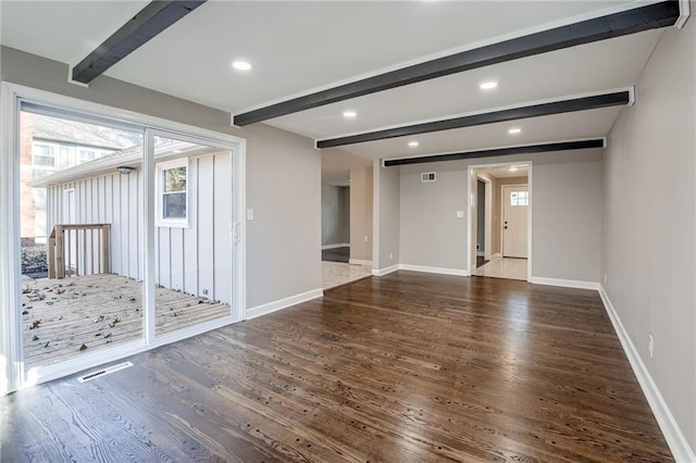 unfurnished room featuring beam ceiling and dark hardwood / wood-style floors