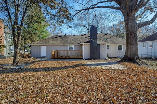 rear view of property with a wooden deck