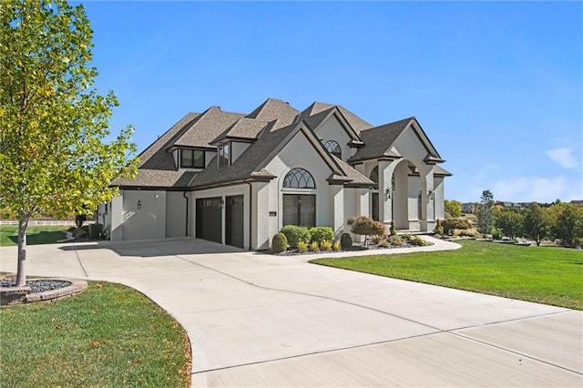 view of front facade with a front lawn and a garage