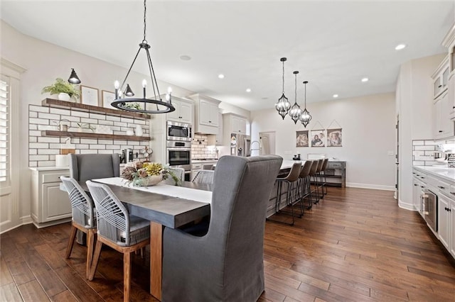 dining space featuring dark hardwood / wood-style floors