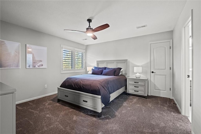 bedroom with dark colored carpet and ceiling fan