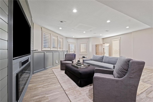 living room with light hardwood / wood-style flooring