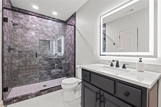 bathroom with tile patterned flooring, vanity, toilet, and an enclosed shower