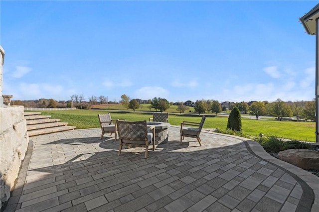 view of patio / terrace featuring an outdoor fire pit