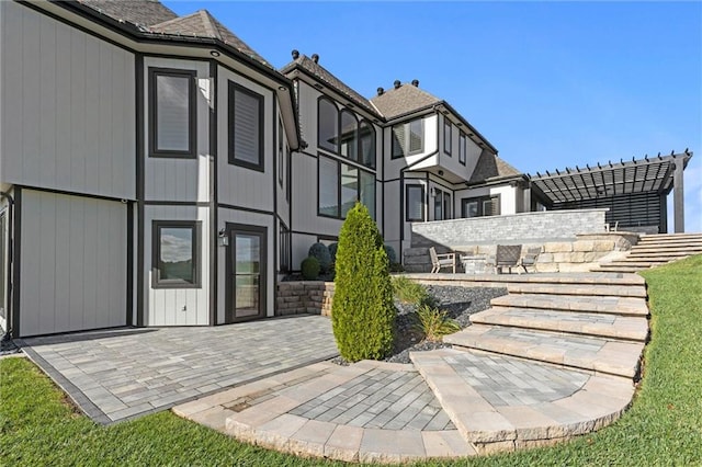 rear view of property featuring a patio