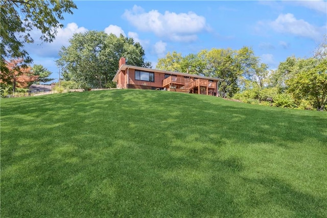 view of yard with a wooden deck