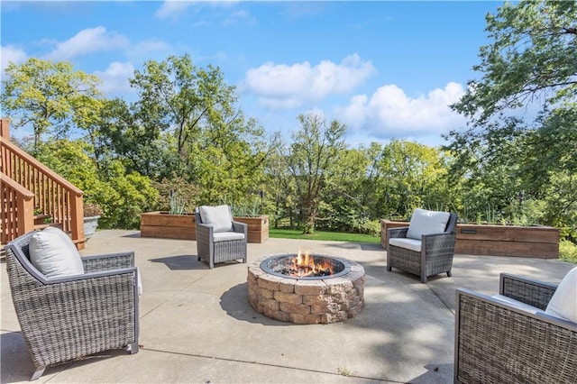 view of patio with an outdoor fire pit