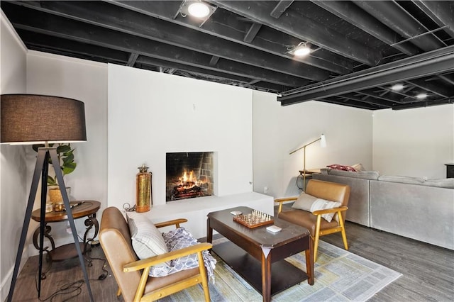 sitting room featuring dark wood-type flooring