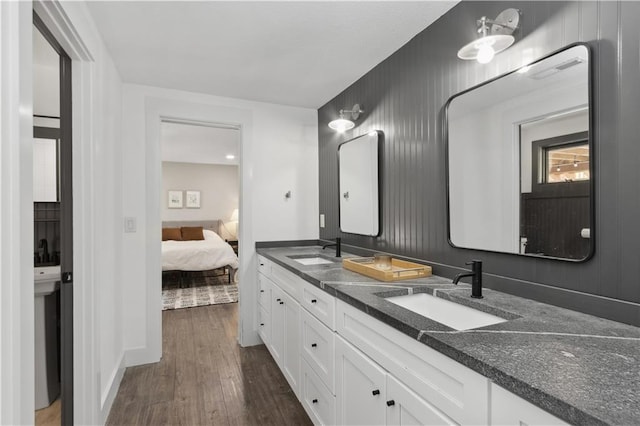 bathroom with hardwood / wood-style floors and vanity