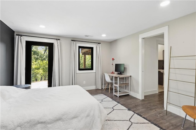 bedroom featuring access to outside and dark wood-type flooring