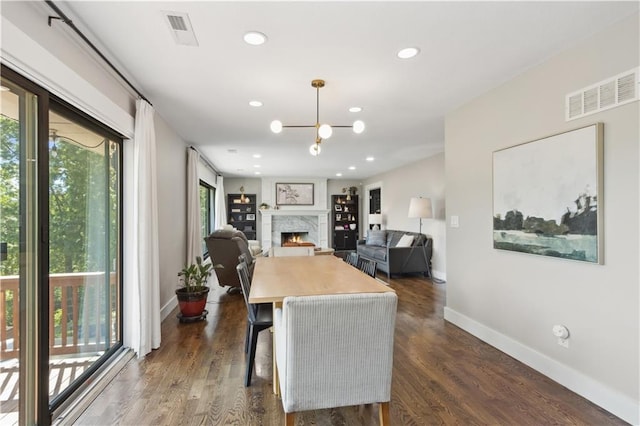 dining area featuring dark hardwood / wood-style flooring and plenty of natural light