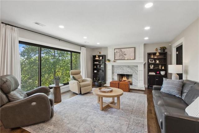 living room featuring hardwood / wood-style floors and a fireplace