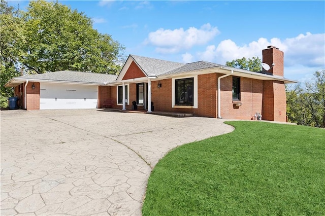 ranch-style home featuring a front yard and a garage