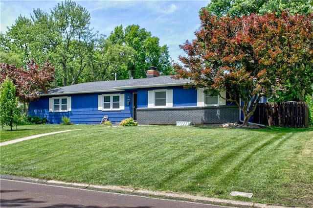 single story home with a front yard