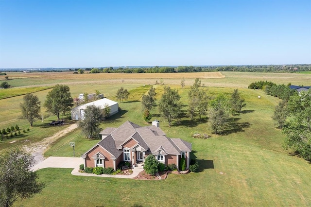 birds eye view of property featuring a rural view