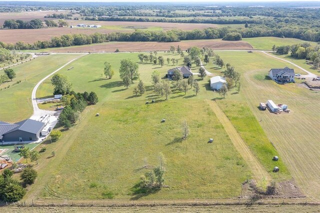 birds eye view of property featuring a rural view