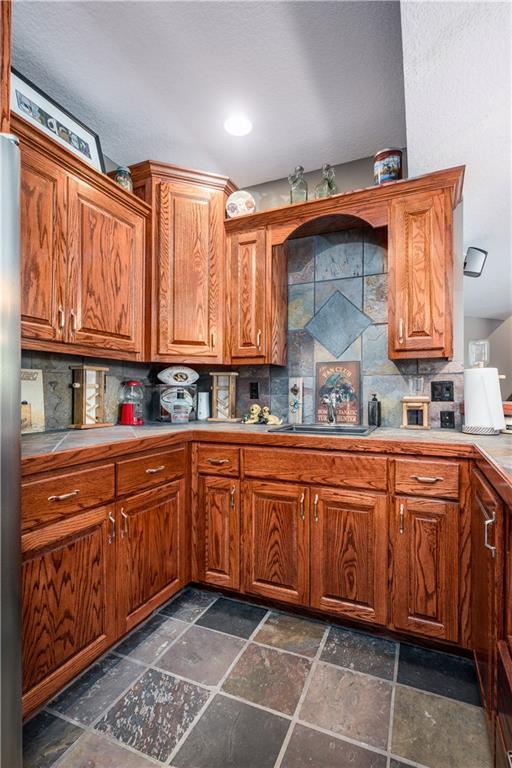 kitchen with tasteful backsplash and sink