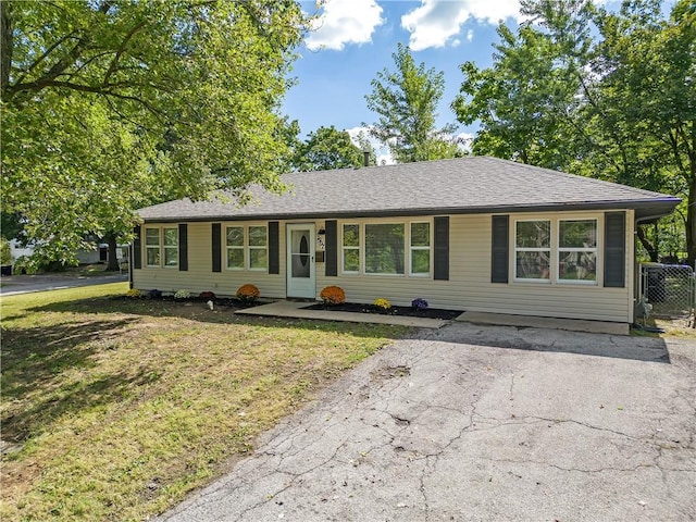 ranch-style house with a front lawn