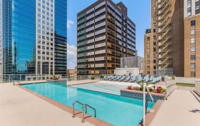 view of swimming pool with a patio area