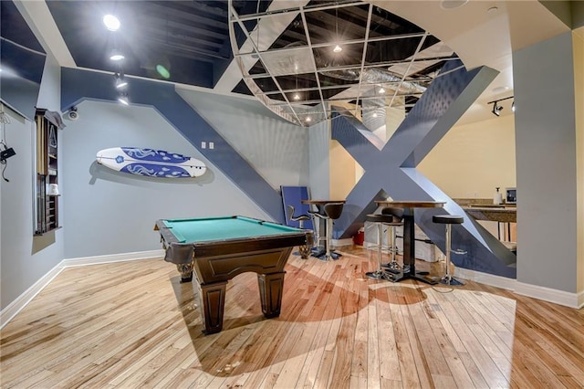 recreation room with high vaulted ceiling, billiards, and hardwood / wood-style floors