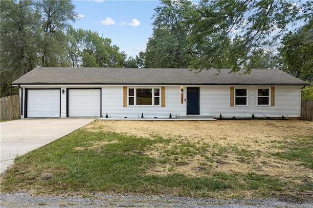 single story home featuring a front lawn and a garage