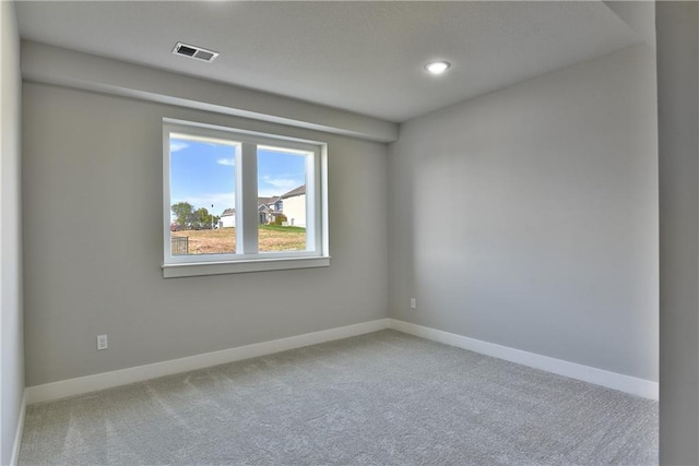 empty room featuring carpet flooring