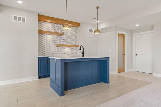 17504 Acton St, Overland Park, KS 66085 - kitchen featuring open shelves, backsplash, visible vents, and blue cabinets