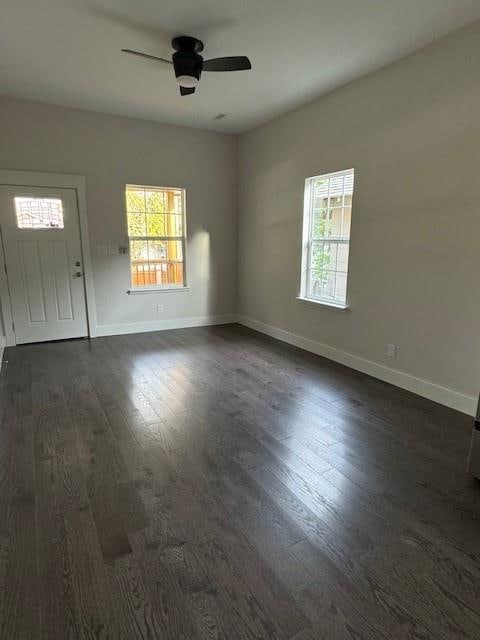 interior space featuring dark hardwood / wood-style floors and ceiling fan