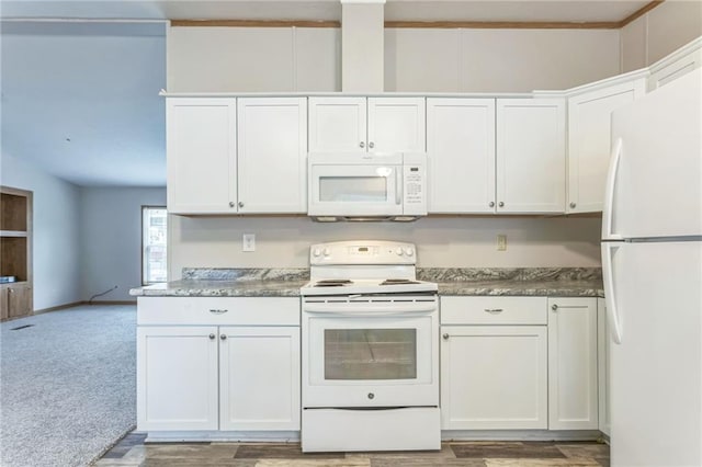 kitchen featuring carpet, white appliances, and white cabinets