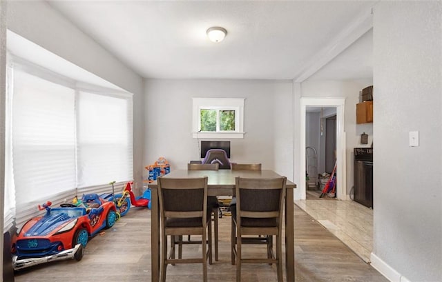 dining room with wood-type flooring