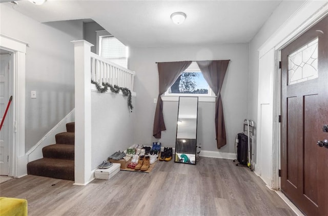 mudroom with light hardwood / wood-style flooring