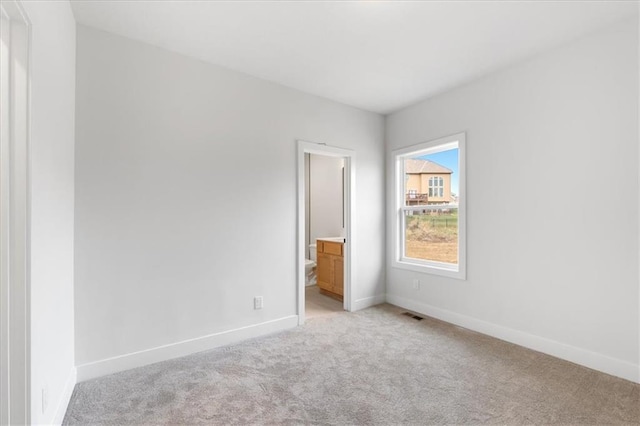 view of carpeted spare room