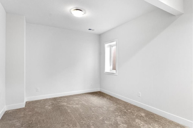 unfurnished room with carpet flooring