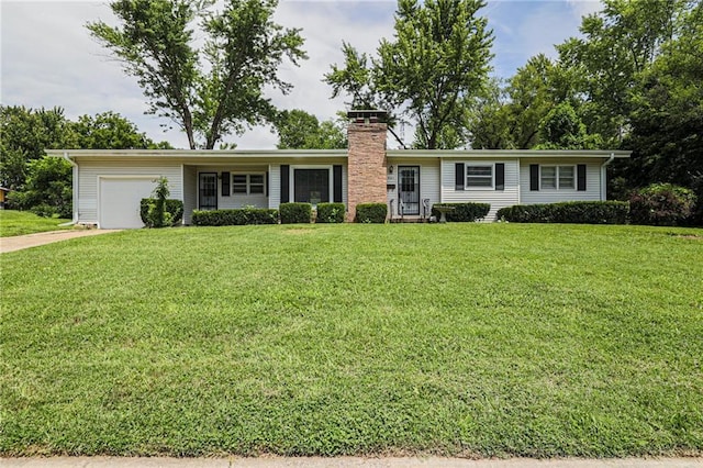 ranch-style home featuring a front yard and a garage