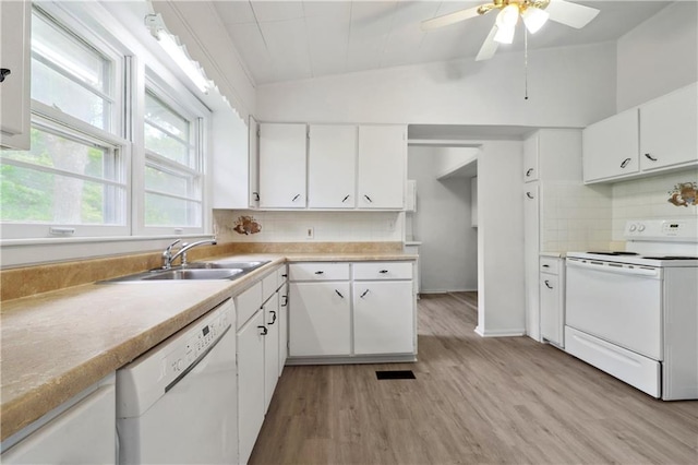 kitchen with dishwasher, light hardwood / wood-style floors, electric range, white cabinets, and vaulted ceiling