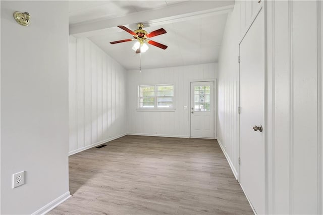 empty room with light wood-type flooring and ceiling fan