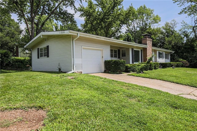 ranch-style house with a garage and a front lawn