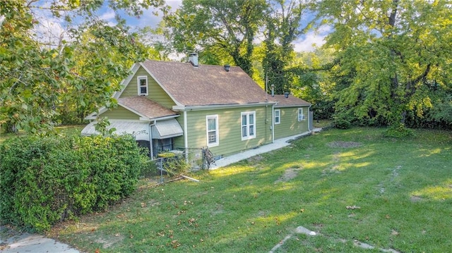 view of property exterior featuring a lawn