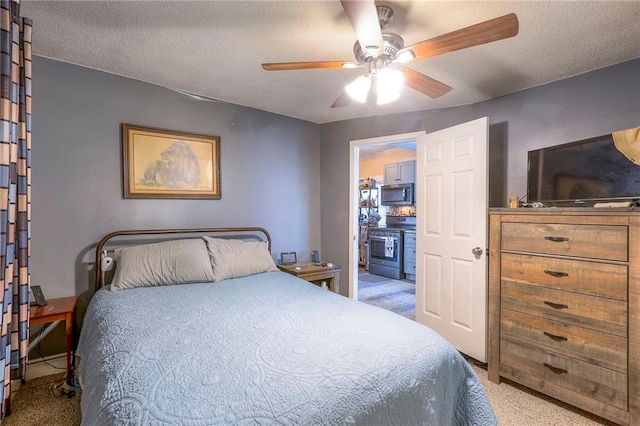 bedroom featuring light carpet, a textured ceiling, and ceiling fan