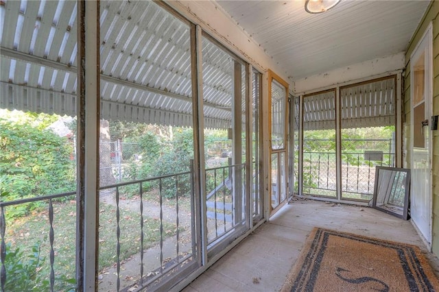 unfurnished sunroom with plenty of natural light