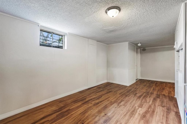 basement featuring a textured ceiling and hardwood / wood-style flooring