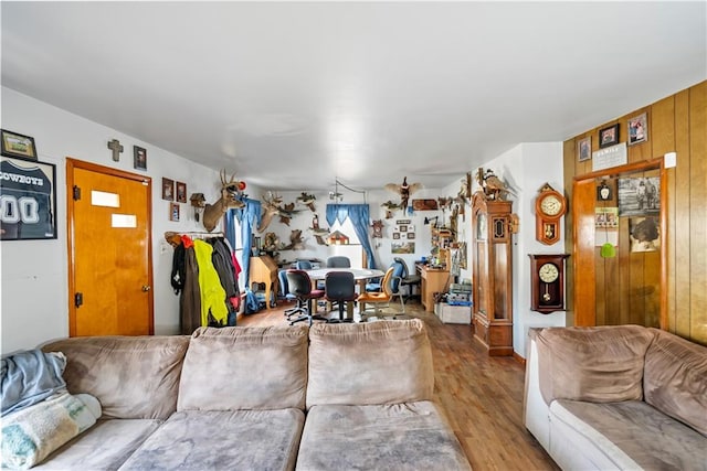 living room featuring wood walls and hardwood / wood-style floors